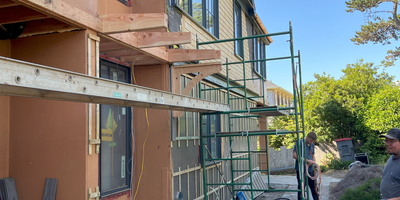 A house under construction with scaffolding